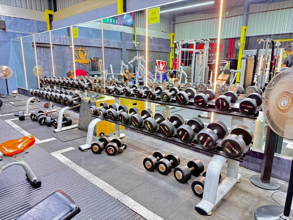 Dumbbell rack and mirrors at Muscle Time Fitness, Hinjawadi